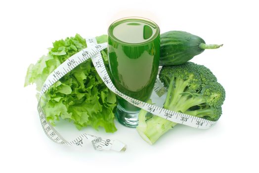 Tape measure wrapped around a refreshing green vegetable juice 