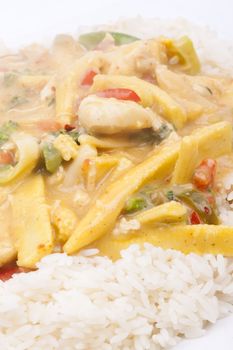 diced chicken in coconut curry sauce served with rice