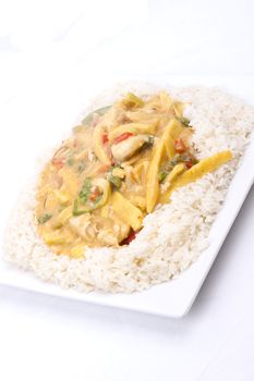 diced chicken in coconut curry sauce served with rice