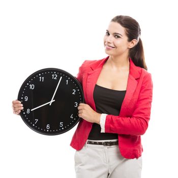 Business woman holding a big clock on the hands