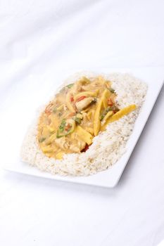 diced chicken in coconut curry sauce served with rice