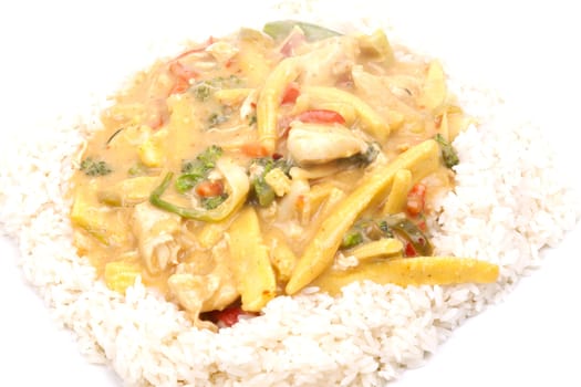 diced chicken in coconut curry sauce served with rice