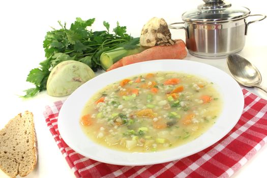 fresh delicious Barley porridge with bread on a light background