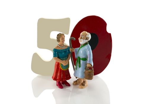 happy older couple with fifty in numbers