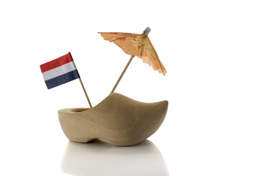 dutch wooden show with the flag and orange umbrella