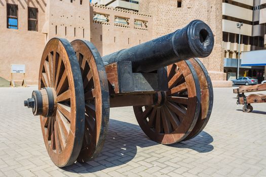 old cast-iron cannon near the old fortress in Sharjah