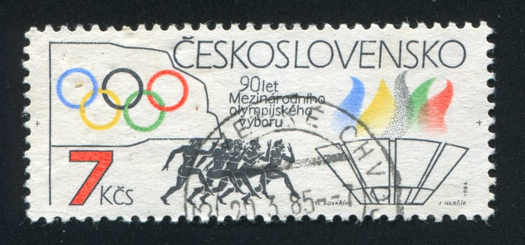 CZECHOSLOVAKIA - CIRCA 1984: stamp printed by Czechoslovakia, shows Rings, runners, torch, circa 1984