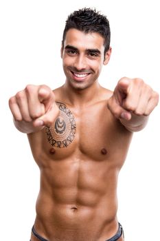 Fit man pointing front over white background