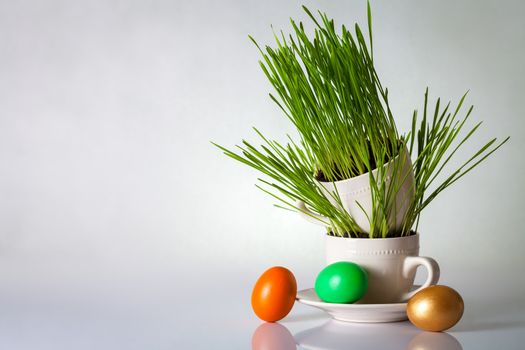 Easter eggs with green grass. Holiday composition with copy space