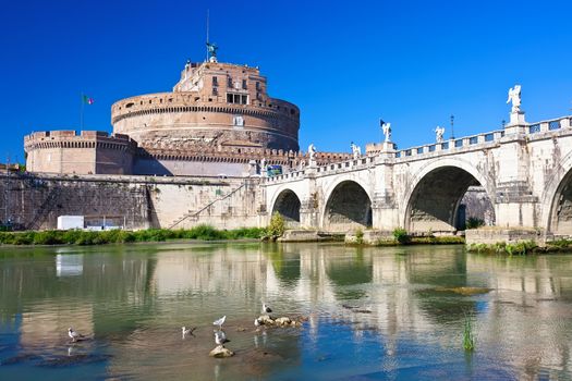 Famous Saint Angel castle and bridge over Tiber river in Rome, Italy