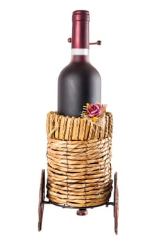 Bottle of red wine in wheeled basket isolated on white background with clipping path