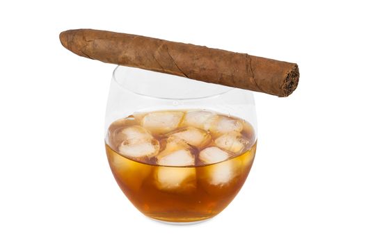 Glass of whiskey with ice and cigar isolated on white background with clipping path