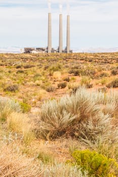 Electrical power station in the middle of a green field