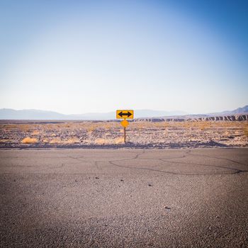 Death Valley, California. Direction sign in the middle of the desert.