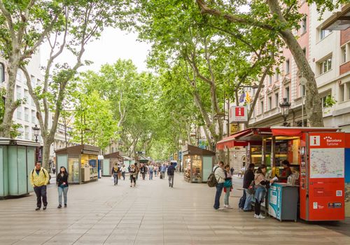 BARCELONA, SPAIN - MAY 31 People walking in the famous and touristic La Rambla street, in Barcelona, Spain, on May 31, 2013