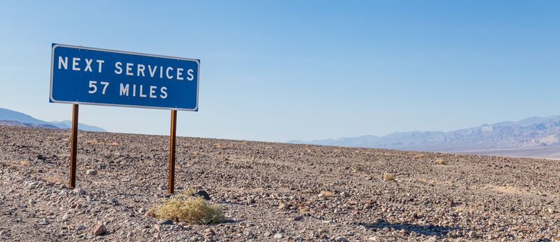 Death Valley, USA. Next service streetsight useful for travel concept