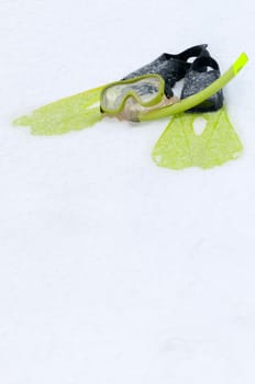 Shot of snorkel, mask and flippers on the snow