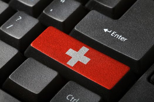 The Swiss flag button on the keyboard. close-up