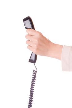 A hand holding a black telephone handset over a white background.