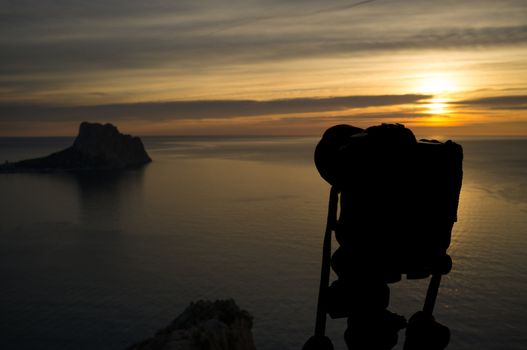 Camera on tripod to shoot a scenic Mediterranean sunrise