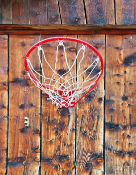 Basketball Hoop on the Background of Wooden Wall