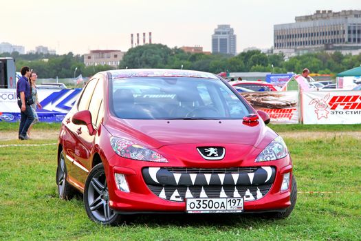 MOSCOW, RUSSIA - JULY 6: French motor car Peugeot 308 exhibited at the annual International Motor show Autoexotica on July 6, 2012 in Moscow, Russia.