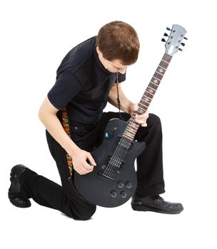 Man in black clothes with an electric guitar