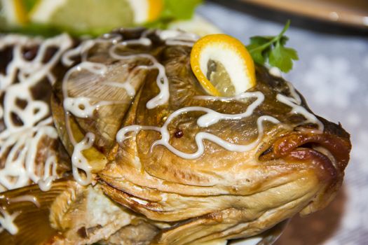 gefilte fish with lemon on dish