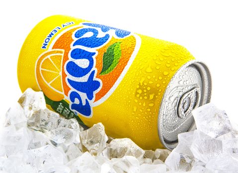 SWINDON, UK - JANUARY 25, 2014:  Fanta Icy Lemon on a bed of ice over white background