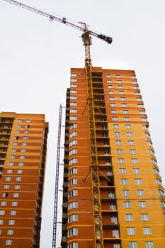 High rise construction. Brick houses under construction