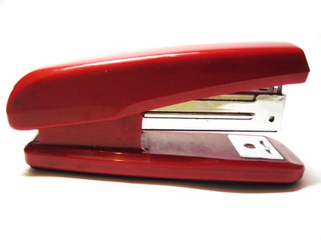 Red stapler isolated on the white background
