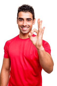 Man showing Ok sign over white background