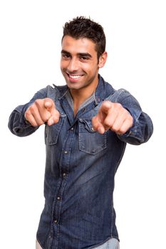 Portrait of a smiling young man pointing front