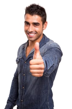 Portrait of a young man showing thumbs up