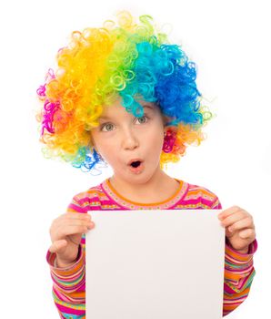 smiling little girl in clown wig with white blank isolated on white background