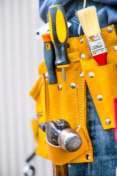 set of tools in a bag on the belt worker