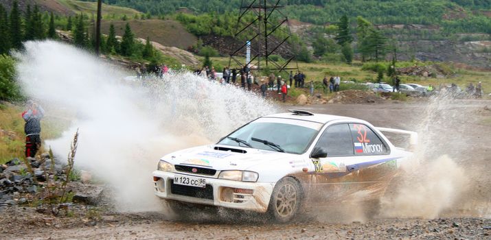 BAKAL, RUSSIA - AUGUST 8: Alexey Mironov's Subaru Impreza (No. 32) competes at the annual Rally Southern Ural on August 8, 2009 in Bakal, Satka district, Chelyabinsk region, Russia.