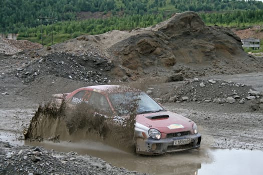 BAKAL, RUSSIA - AUGUST 8: Sergey Nenyuhin's Subaru Impreza (No. 73) competes at the annual Rally Southern Ural on August 8, 2009 in Bakal, Satka district, Chelyabinsk region, Russia.