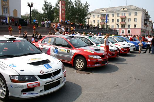 SATKA, RUSSIA - AUGUST 13: Competitors of the annual Rally Southern Ural are represented on the city square on August 13, 2010 in Satka, Chelyabinsk region, Russia.