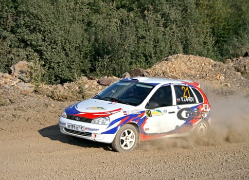 BAKAL, RUSSIA - AUGUST 13: Vasiliy Lavrov's LADA Kalina (No. 21) competes at the annual Rally Southern Ural on August 13, 2010 in Bakal, Satka district, Chelyabinsk region, Russia.