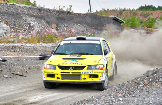 BAKAL, RUSSIA - JULY 21: Andrey Smirnov's Mitsubishi Lancer Evo IX (No. 11) competes at the annual Rally Southern Ural on July 21, 2012 in Bakal, Satka district, Chelyabinsk region, Russia.