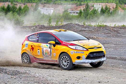 BAKAL, RUSSIA - JULY 21: Ivan Vorobyov's Ford Fiesta (No. 15) competes at the annual Rally Southern Ural on July 21, 2012 in Bakal, Satka district, Chelyabinsk region, Russia.