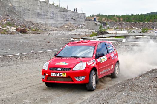 BAKAL, RUSSIA - JULY 21: Alexey Konstantinov's Ford Fiesta (No. 25) competes at the annual Rally Southern Ural on July 21, 2012 in Bakal, Satka district, Chelyabinsk region, Russia.