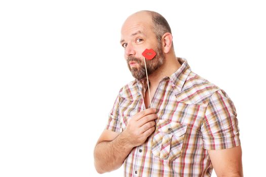 An image of a handsome bearded man holding lips