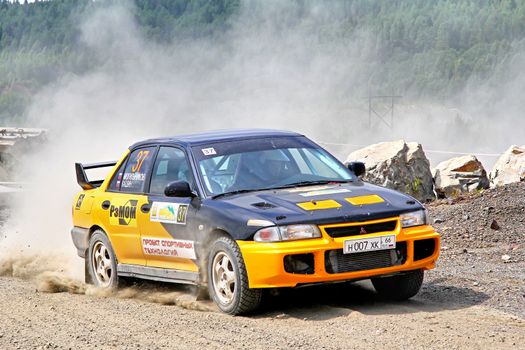 BAKAL, RUSSIA - JULY 21: Dmitry Mogilnikov's Mitsubishi Lancer Evo III (No. 37) competes at the annual Rally Southern Ural on July 21, 2012 in Bakal, Satka district, Chelyabinsk region, Russia.