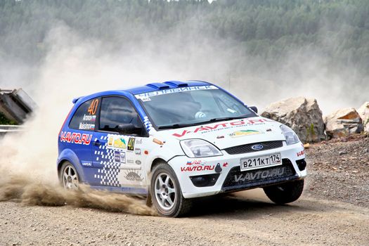 BAKAL, RUSSIA - JULY 21: Maxim Aronov's Ford Fiesta (No. 40) competes at the annual Rally Southern Ural on July 21, 2012 in Bakal, Satka district, Chelyabinsk region, Russia.