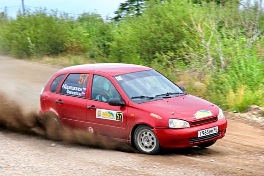 BAKAL, RUSSIA - JULY 21: Ruslan Abdrakhmanov's Lada Kalina (No. 57) competes at the annual Rally Southern Ural on July 21, 2012 in Bakal, Satka district, Chelyabinsk region, Russia.