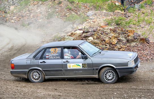 BAKAL, RUSSIA - AUGUST 21: Konstantin Berezin's Audi 80 (No. 59) competes at the annual Rally Southern Ural on August 21, 2012 in Bakal, Satka district, Chelyabinsk region, Russia.
