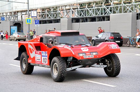 MOSCOW, RUSSIA - JULY 7: Beniat Errandonea's SMG Buggy No. 113 of SMG Team takes part at the annual Silkway Rally - Dakar series on July 7, 2012 in Moscow, Russia.