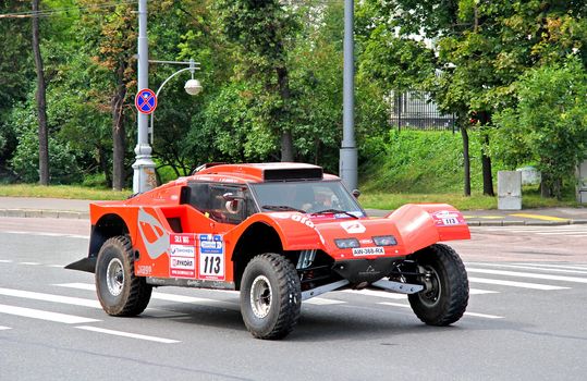 MOSCOW, RUSSIA - JULY 7: Beniat Errandonea's SMG Buggy No. 113 of SMG Team takes part at the annual Silkway Rally - Dakar series on July 7, 2012 in Moscow, Russia.